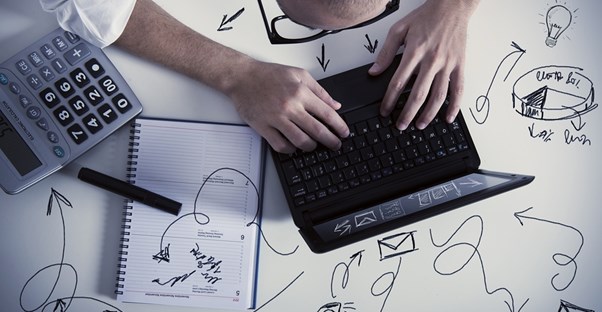 Man at laptop with arrows coming from his head