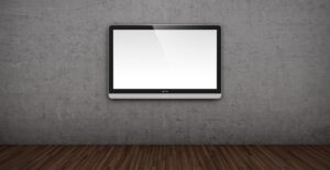 A flatscreen tv mounted on a blank wall