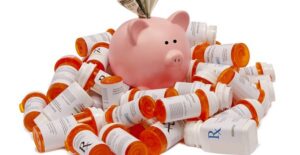 Piggy Bank on a mountain of pill bottles