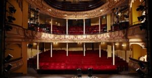 a view of a broadway theater as seen from the stage looking out toward the seats
