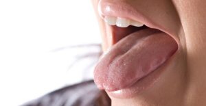 a man experiencing halitosis symptoms