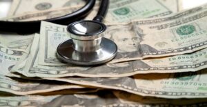 Stethoscope on twenty dollar bills