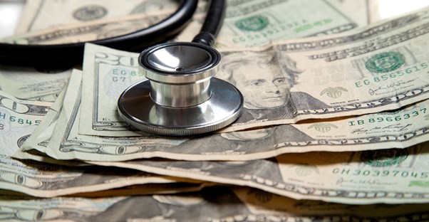 Stethoscope on twenty dollar bills
