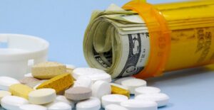 Pill bottle filled with money