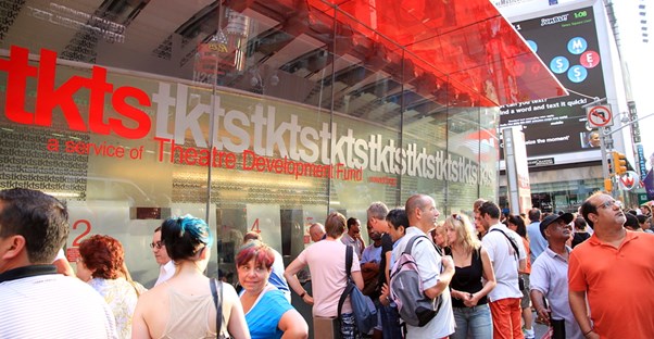 patrons stand in line to receive discounted broadway tickets