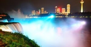 a view of niagara falls lit up at night
