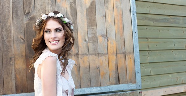 A bride smiles for wedding photos