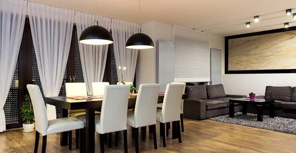 Strategically placed window treatments that make a dining room look larger.