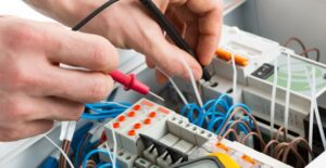Electrician does something with wires