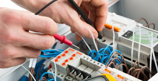 Electrician does something with wires