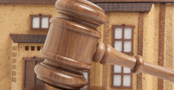 Gavel in front of a building