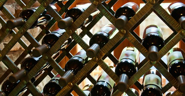 Newly stocked home bar wine shelves