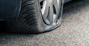 A flat tire that needs to be changed