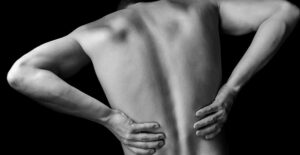 a woman suffering from ankylosing spondylitis symptoms