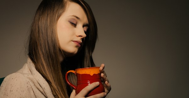 An expectant mother tries a home remedy for morning sickness