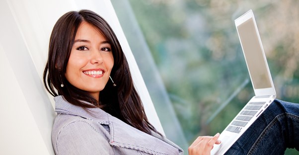 a woman enjoys her match on an online dating website