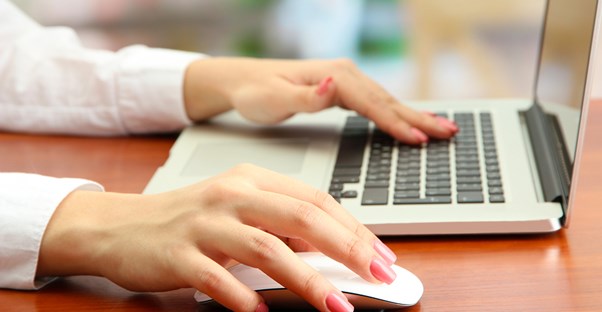 Woman using a computer to set up a trust fund