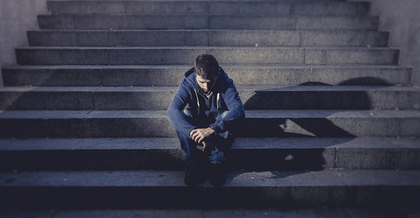 a boy suffering from depression causes