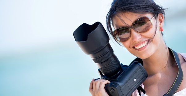 Photographer smiling after downloading a new program