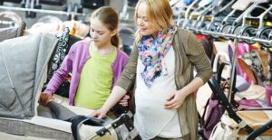 Stylish pregnant woman shopping