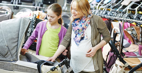 Stylish pregnant woman shopping