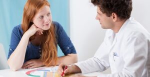 a doctor discussing teen pregnancy
