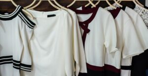 Black and white dresses hang in a closet