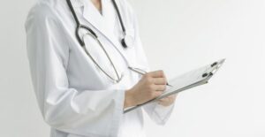 A doctor reviewing hepatitis c treatments