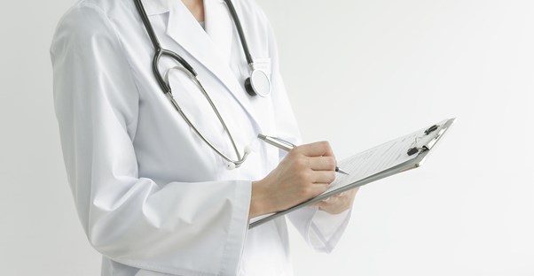 A doctor reviewing hepatitis c treatments