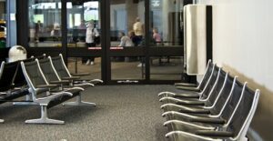 An empty waiting room looks out to the hospital curb where patients are waiting to be picked up.