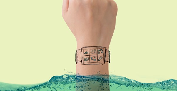 a person who is trying to clean a smart watch