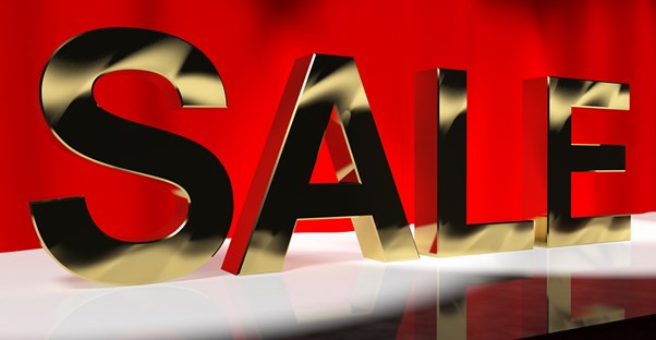 a sale sign shows the way to discounted branson show tickets
