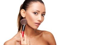 a woman concealing her rosacea