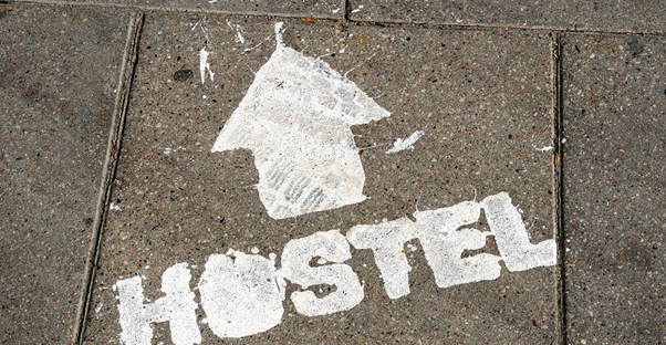 an arrow points the way toward a sydney hostel