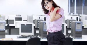 Professional Woman suffering from chronic shoulder pain