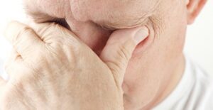 a man suffering from the symptoms of macular degeneration
