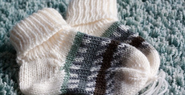 a pair of baby knitted baby socks
