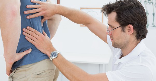 a man being diagnosed with sciatica