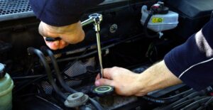 A mechanic performing a routine car inspection