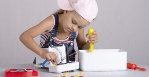A child repairing a dangerous appliance