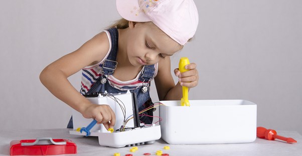 A child repairing a dangerous appliance