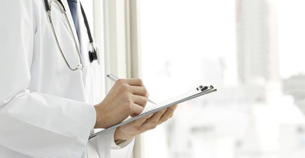 a doctor writing down four things that a pap smear does not detect