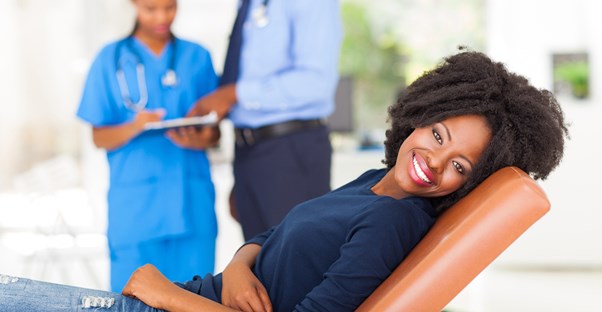 a woman preparing for her first pap smear