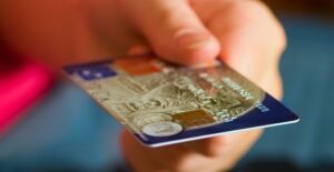 Person holding a charge card