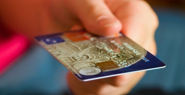 Person holding a charge card