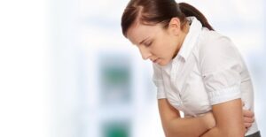 a woman experiencing sickle cell anemia symptoms