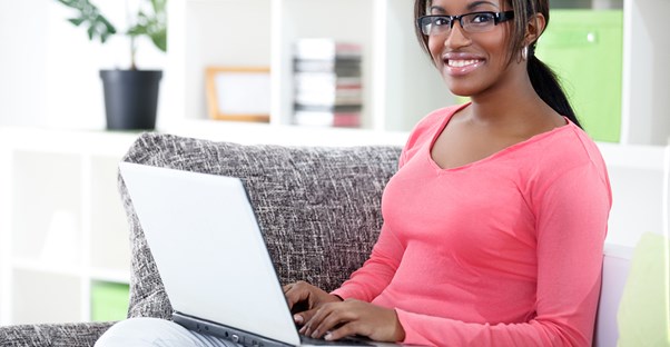 woman sitting on a chair with her laptop