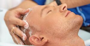 a man enjoying sulfate-free shampoo
