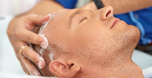 a man enjoying sulfate-free shampoo