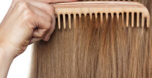 a woman applying dry shampoo